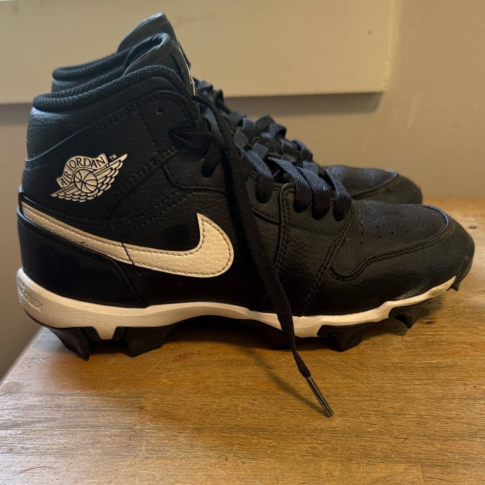 Nike Black and White High-Top Cleats